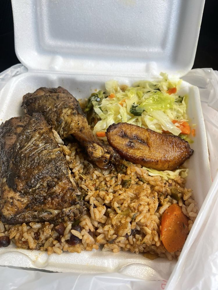 Jerk chicken plate with rice and peas, cabbage, and plantain at Kemper's Cafe